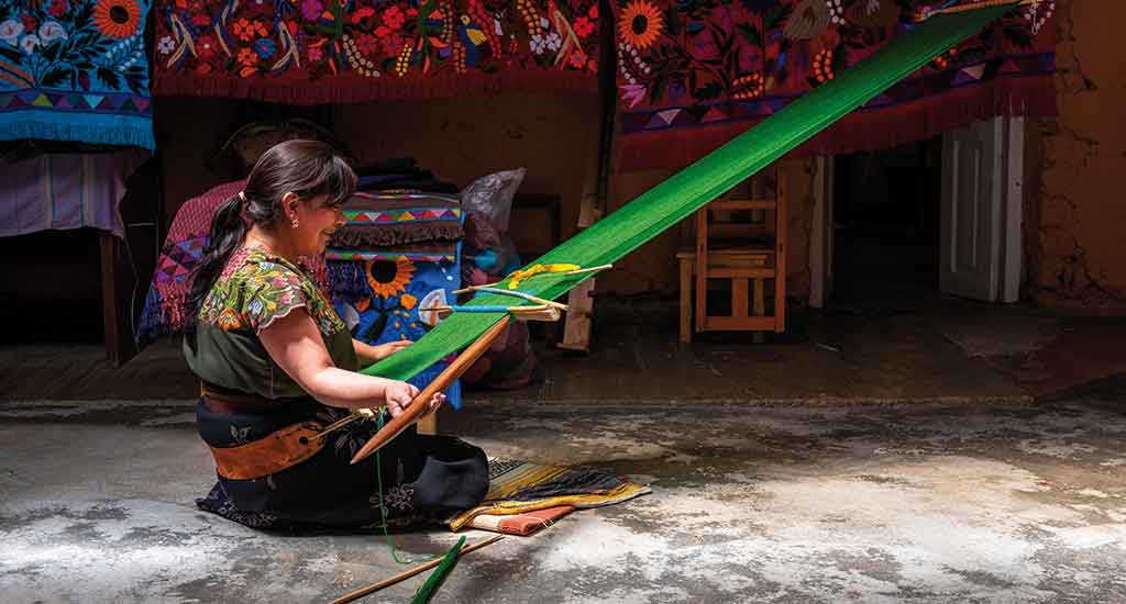 Mayan woman weaving in Zinacantan Mexico