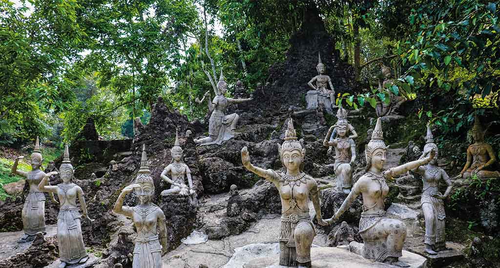 Ancient stone statues in secret Buddhism magic garden in Koh Samui