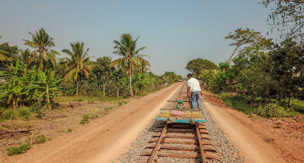 Local riding a bamboo train